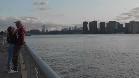 Young-cuddly-couple-on-Long-Island-City-boardwalk