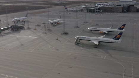 Inactive-Boeing-aircraft-parked-on-open-tarmac-at-airport-during-global-pandemic