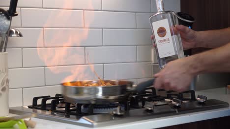 Chef-creating-flames-while-flambé-with-gin