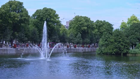 View-at-Buitenhof-of-Hofvijver-fountain-with-island-in-background-in-Dutch-city-Den-Haag-on-a-cloudy-day