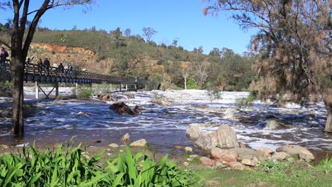 Bells-Rapids-Perth-People-Crossing-Bridge-With-Fast-Flowing-Swan-River