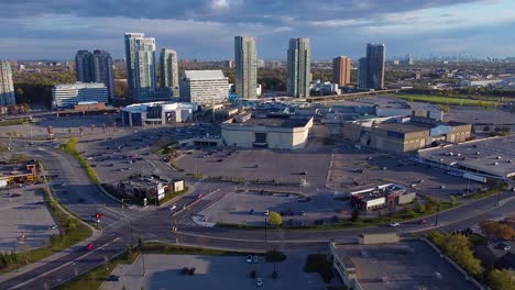 Scarborough-Town-Centre-aerial-drone-shot-showing-large-shopping-mall,-big-box-stores-and-condo-developments