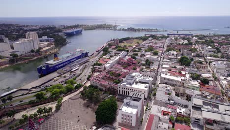 Drone-flying-over-zone-Santo-Domingo-port-with-Caribbean-ferry-moored-at-pier