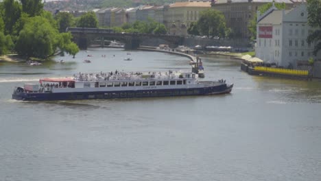 European-People-on-Tourist-Boat-on-Vltava-River-in-Prague,-Czech-Republic