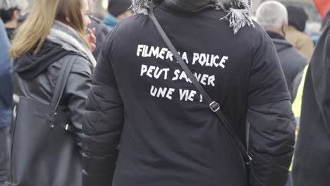 Women-who-participate-in-protest-against-proposed-new-security-law-that-would-restrict-publishing-images-of-police,-are-wearing-a-t-shirt-which-says-that-filming-a-police-can-save-a-life