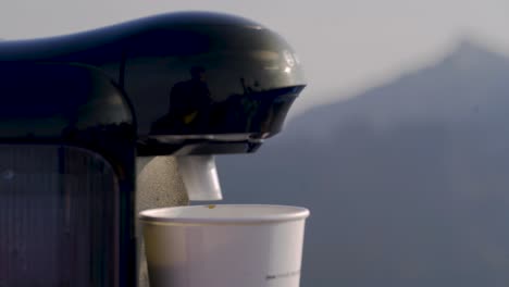 Making-coffee-at-the-top-of-a-mountain-in-Norway,-handheld,-static