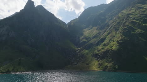 The-lake-of-Soulcem-in-the-French-Pyrenees-mountains-with-the-typical-pic-du-Madelon-in-view