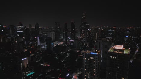 Bangkok-Cityscape-Illuminated-At-Night-In-Thailand---Aerial-Drone-Shot