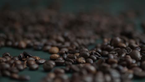 Dolly-left-of-coffee-beans-on-the-dark-green-background