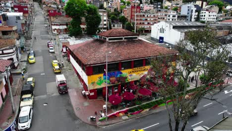 Orbit-shot-of-Plaza-de-Mercado-La-Perseverancia-in-Bogotá,-mural-and-mosaic-art-painted-by-a-group-of-artists-in-2017