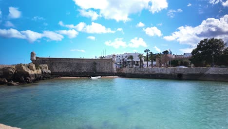 Motion-Time-Lapse-of-Fort-of-Ponta-da-Bandeira-and-Promenade-in-Lagos,-Algarve