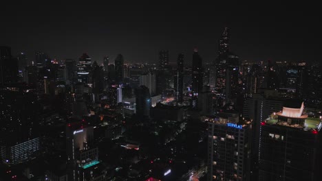 Bangkok-Buildings-Illuminated-At-Night-In-Thailand---Aerial-Shot