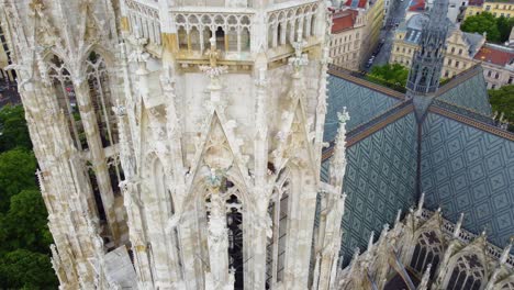 Closer-aerial-rooftop-and-two-towers-details-from-the-catholic-Votive-Church-in-Vienna,-Austria