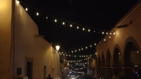 Street-at-night,-decorated-with-lights-in-La-Huasteca,-central-Mexico