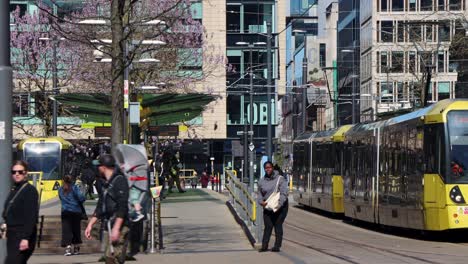 Cityscape-of-Manchester-with-yellow-Metrolink-trams,-static-view