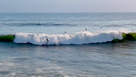 Surfer-Over-Tidal-Waves-Near-Bird-Rock-In-La-Jolla,-San-Diego,-California-USA