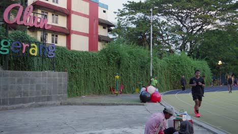 City-park-entrance-sign-with-colorful-text-and-greenery-in-front-of-a-building-in-Kota-Tangerang