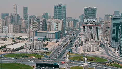 Traffic-flows-on-Sharjah's-Al-Ittihad-Street,-known-as-Sharjah-Dubai-Road-in-the-UAE