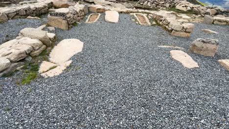 We-see-an-archaeological-area-restored-and-cleaned-with-dark-gray-gravel-where-we-see-2-anthropomorphic-tombs-from-the-Visigoth-period-and-some-rows-of-stones-forming-walls