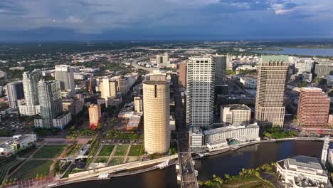 High-aerial-truck-shot-of-Tampa,-Florida-downtown-skyline-during-golden-hour-sunset