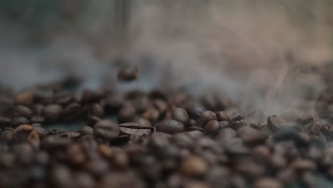 Close-up-time-lapse-of-coffee-beans-falling,-spilling-onto-the-table-into-smoke,-fog