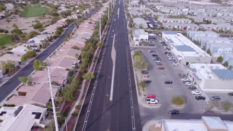 Las-Vegas-USA,-Aerial-View-of-Road-Traffic-in-Western-Neighborhood,-Revealing-Drone-Shot