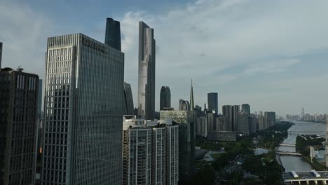 Guangzhou-CBD-Highlighting-Iconic-Skyscrapers-and-Development-Center-in-aerial-pedestal-up-view