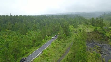 Aerial-view-of-SUV-jeep-vehicle-passing-on-the-forest-road