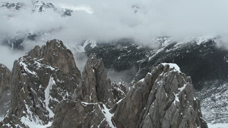 Aerial-View-of-Rocky-Peaks-and-Snow-Capped-Landscape-of-Alps-Above-Innsbruck-Ski-Resort,-Austria