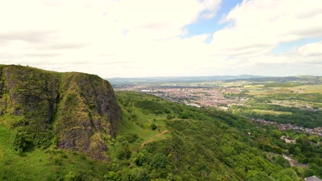 Aerial-shot-of-Cavehill-in-North-Belfast,-NI-on-a-sunny-day