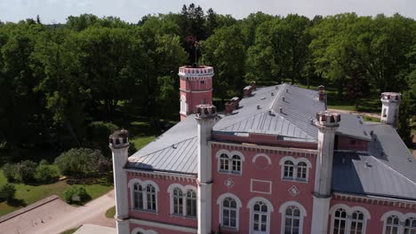 Aerial-view-of-the-small-town-of-Birini-Castle,-located-in-a-green-park