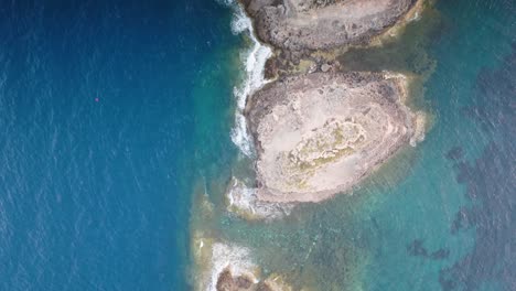 Aerial-top-down-view-of-Punta-de-El-Toro-scattered-rock-formation,-Mallorca