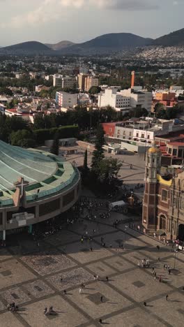 Atrium-of-the-Basilica-de-Guadalupe,-vertical-drone-view