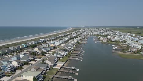 4k-drone-flying-over-Sunset-Beach,-NC-during-the-summer