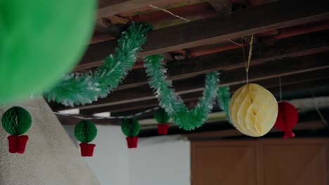 Decorations-for-Portuguese-Popular-Saints-festival-with-colorful-hanging-ornaments-and-tinsel