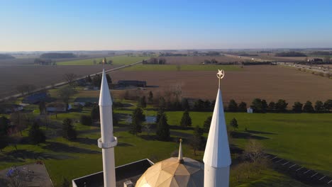 Islamic-Center-of-Greater-Toledo-towers-with-symbols-and-golden-dome,-aerial-view