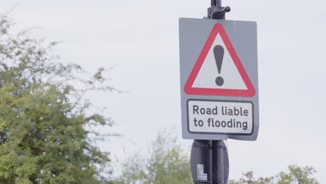 Road-liable-to-flooding-warning-and-awareness-sign-on-street-in-London