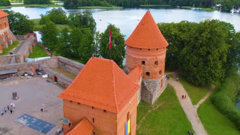 Closer-aerial-view-of-the-Trakai-castle-at-Galve-lake-in-the-town-of-Vilnius,-Lithuania