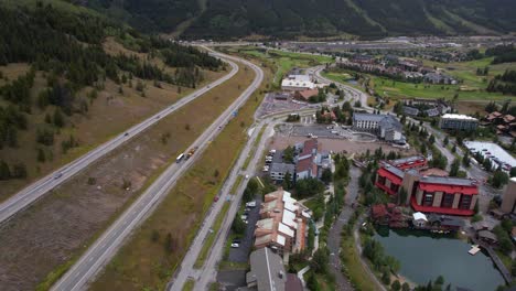 Aerial-View-of-Copper-Mountain-Ski-Resort-Buildings-and-Traffic-on-Interstate-70-Highway-in-Summer-Season,-Colorado-USA