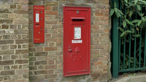 Royal-mail-stamps-and-post-box-in-Ealing-London-United-Kingdom-June-2024