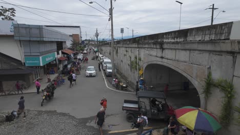 Busy-Sixaola-Border-Crossing-between-Panama-and-Costa-Rica,-people-and-vehicles-in-motion