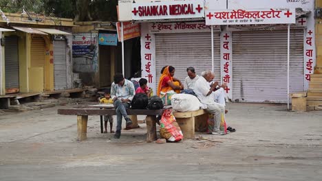 Big-family-waits-for-the-bus-to-arrive-so-they-can-travel-back-home