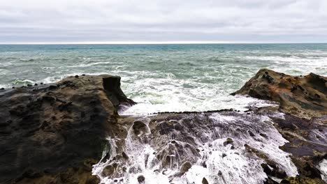 Waves-crash-into-a-rocky-embankment