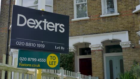 Estate-agent-to-let-signs-outside-home-in-London-United-Kingdom-June-2024