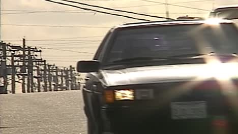 1990S-CARS-ON-ROAD-DRIVING-UNDER-HEAT-WAVE