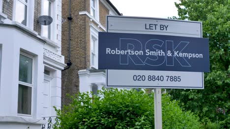 Let-By-estate-agent-sign-in-Ealing-London-United-Kingdom-June-2024