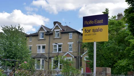 London-property-with-estate-agent-for-sale-sign-outside-London-United-Kingdom-June-2024