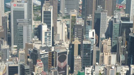 Panning-left,-skyscrapers-stand-like-silent-sentinels,-glass-facades-reflecting