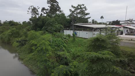 River-at-Sixaola-Border-Crossing-between-Panama-and-Costa-Rica-with-lush-greenery-on-a-cloudy-day