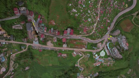 A-top-down-aerial-view-of-Sapa-Town-in-Lao-Cai-Province,-North-Vietnam,-captures-the-seamless-integration-of-cultural-heritage-with-modern-tourism-in-Sa-Pa